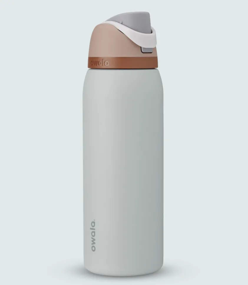 Owala FreeSip 40oz insulated water bottle in Shy Marshmallow color, featuring a built-in straw and leak-proof flip-top lid, designed for all-day hydration.