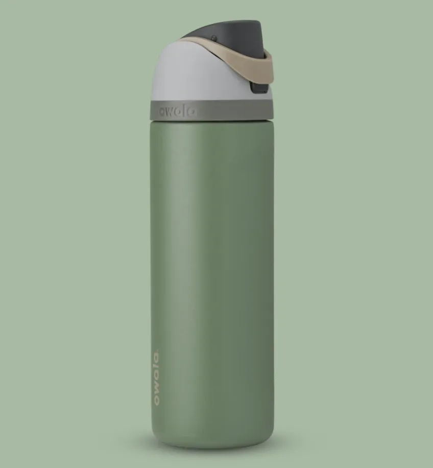 Owala FreeSip 24oz insulated water bottle in Sagebrush color, featuring a covered straw lid and ergonomic design for travel and everyday hydration.