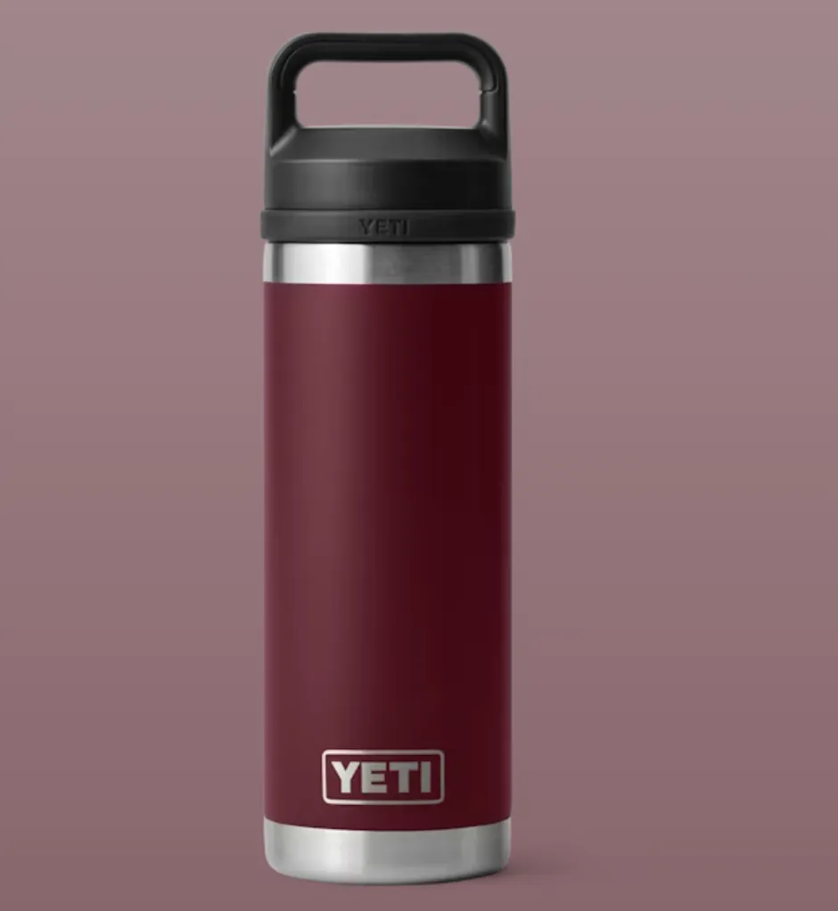 Yeti Rambler 18oz water bottle in Harvest Red with chug cap and durable stainless steel construction, designed for workouts and everyday hydration.